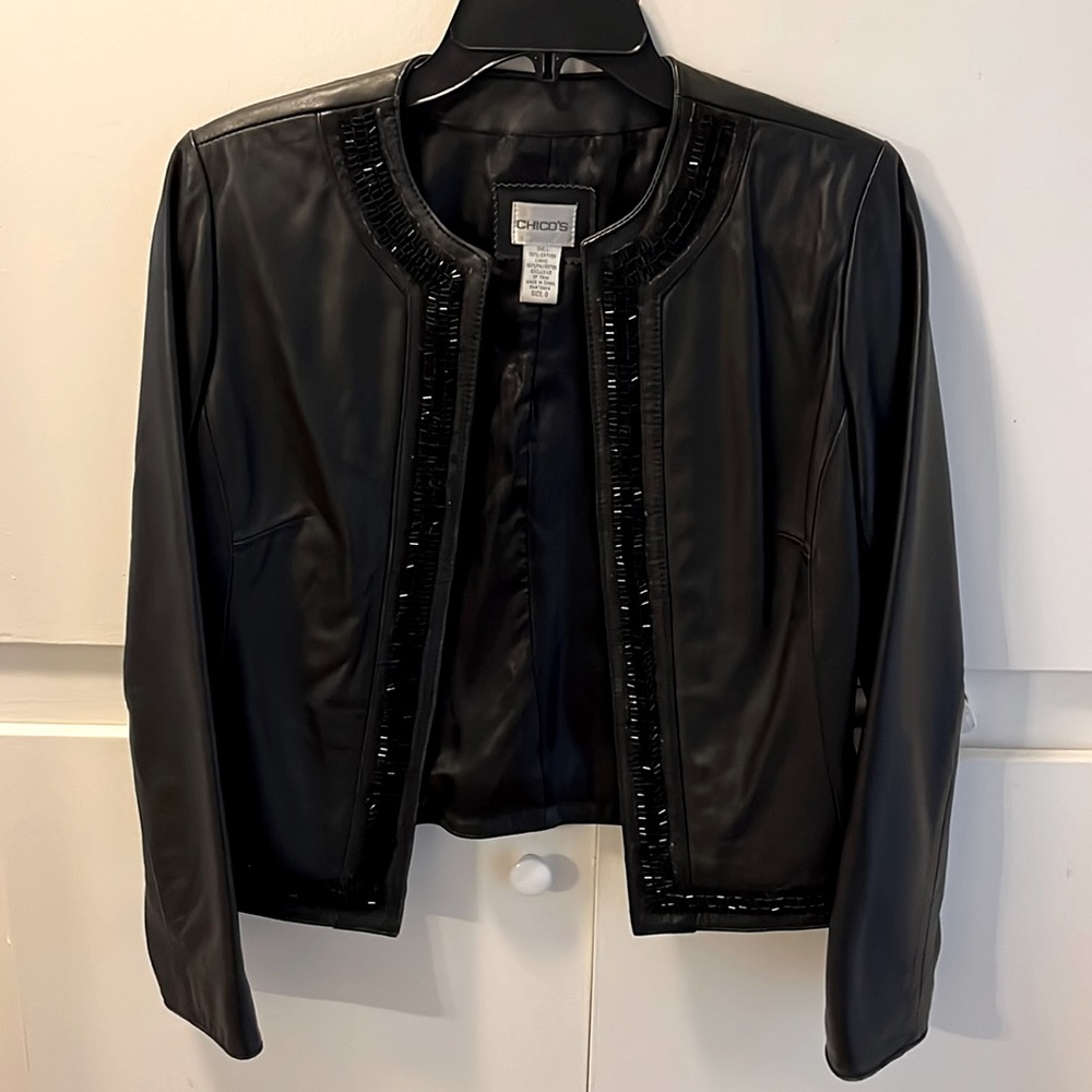 A black leather Chicos jacket size 0, which is a 4 to 6 size